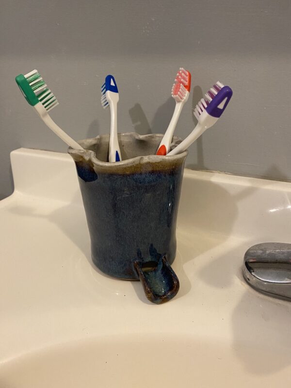 Navy handmade pottery ceramic toothbrush holder that fits electric toothbrushes
