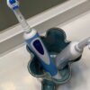 From above view of teal electric toothbrush holder made in the USA