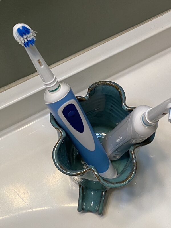 From above view of teal electric toothbrush holder made in the USA